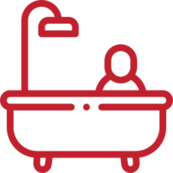 Person in bathtub icon with showerhead.