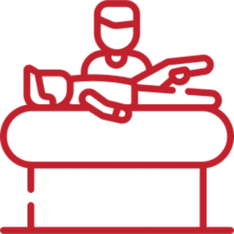 Person receiving treatment on a massage table.